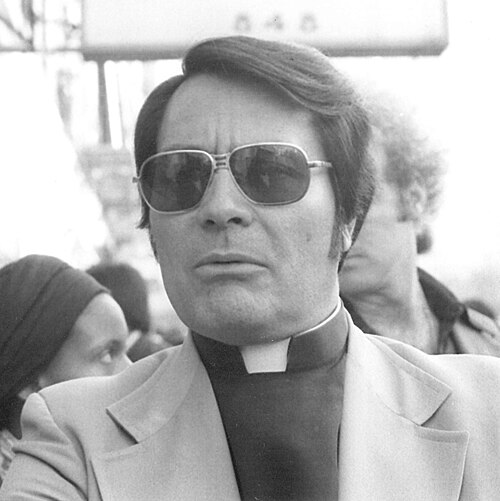 Rev. Jim Jones at an anti-eviction rally Sunday, January 16, 1977 in front of the International Hotel, Kearny and Jackson Streets, San Francisco 
